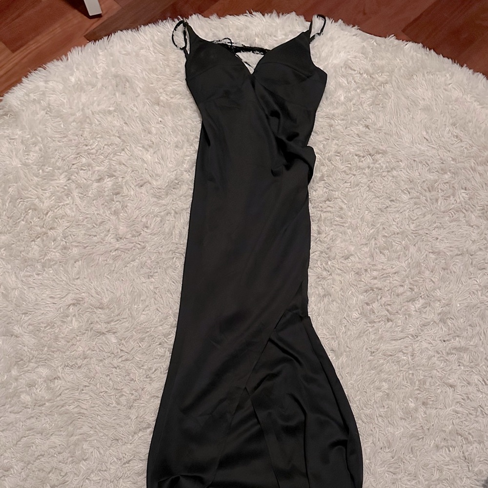 Floor length satin elegant black dress with beaded swoop back.